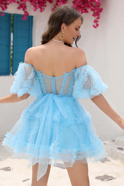 Side view of a model in a pink tulle party dress.