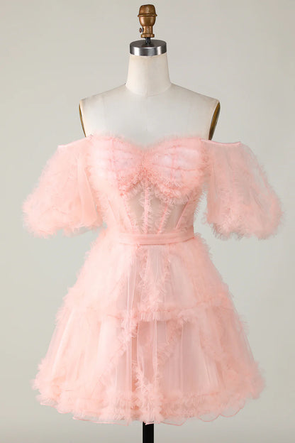 Model showcasing the elegant design of the pink tulle dress.