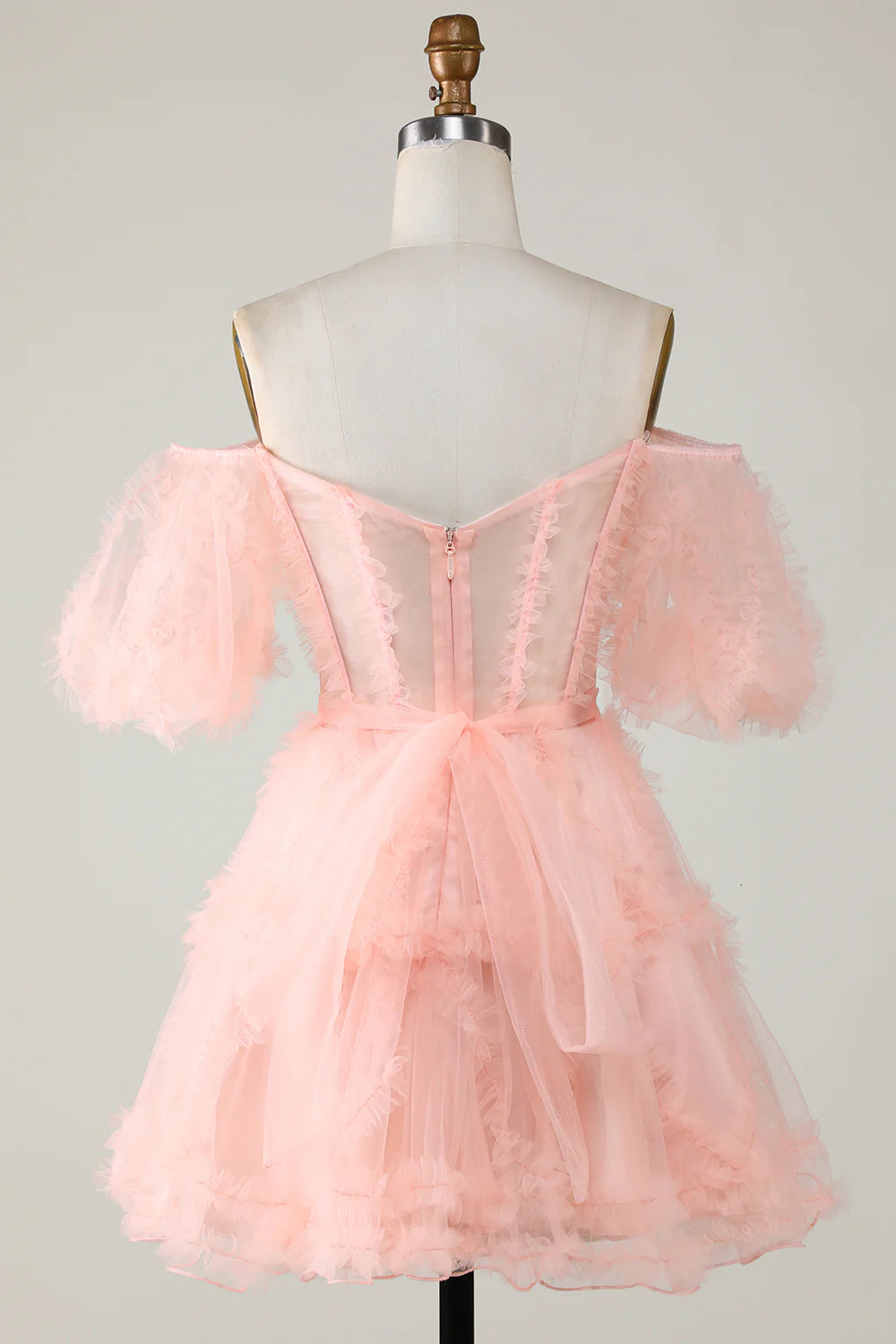 Detailed view of the layered pink tulle skirt.