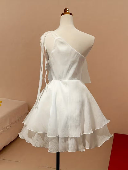 Side view of a short chiffon party dress with ruffles.