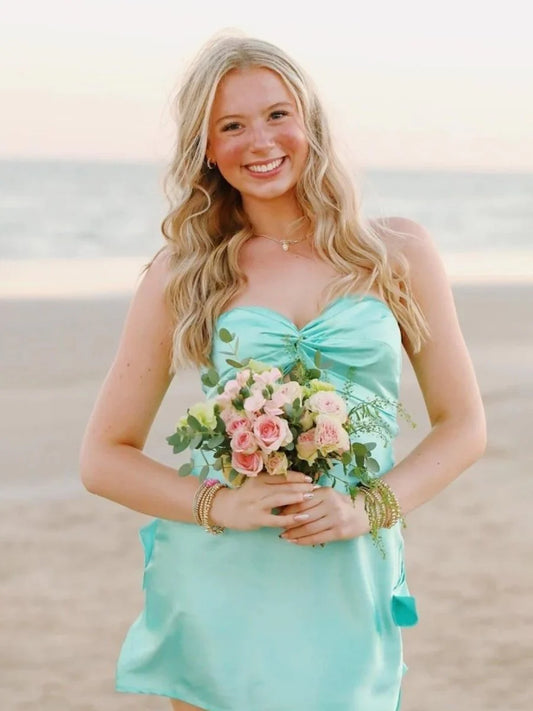 Model wearing a multi-color A-line strapless short homecoming dress with a keyhole back.