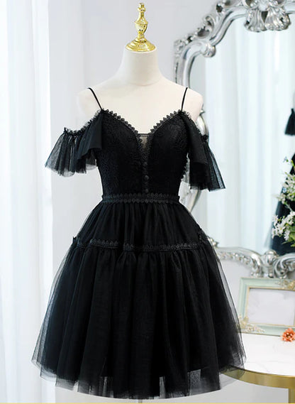 Model wearing a black A-line sweetheart off-shoulder tulle homecoming dress.