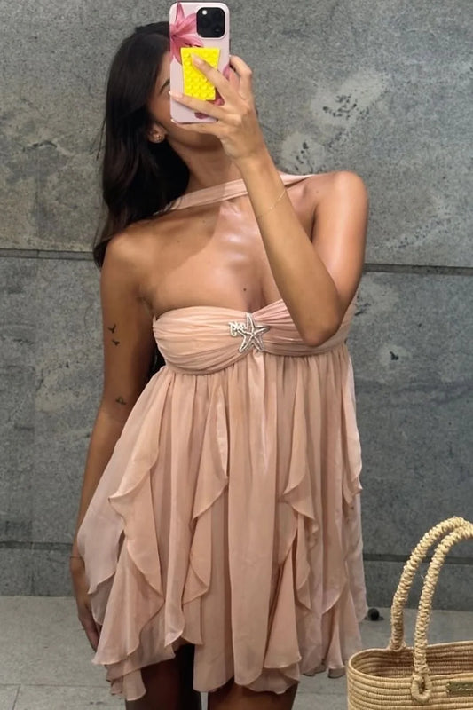 Model wearing a chic pink A-line sweetheart ruched short homecoming dress with ruffles.