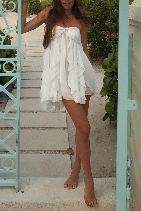 Close-up of the sweetheart neckline and ruched bodice of the pink A-line dress.