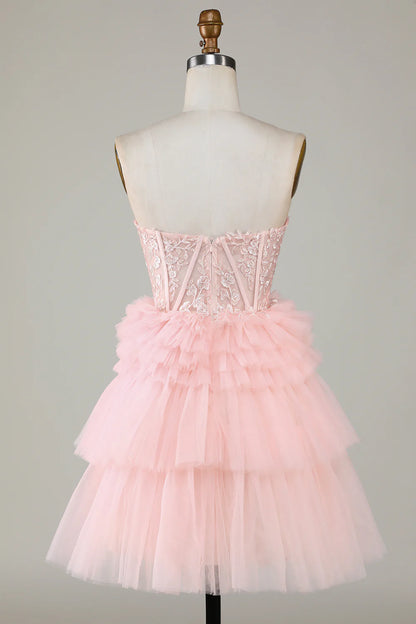 Model posing in the pink A-line sweetheart ruffled short dress, back view.