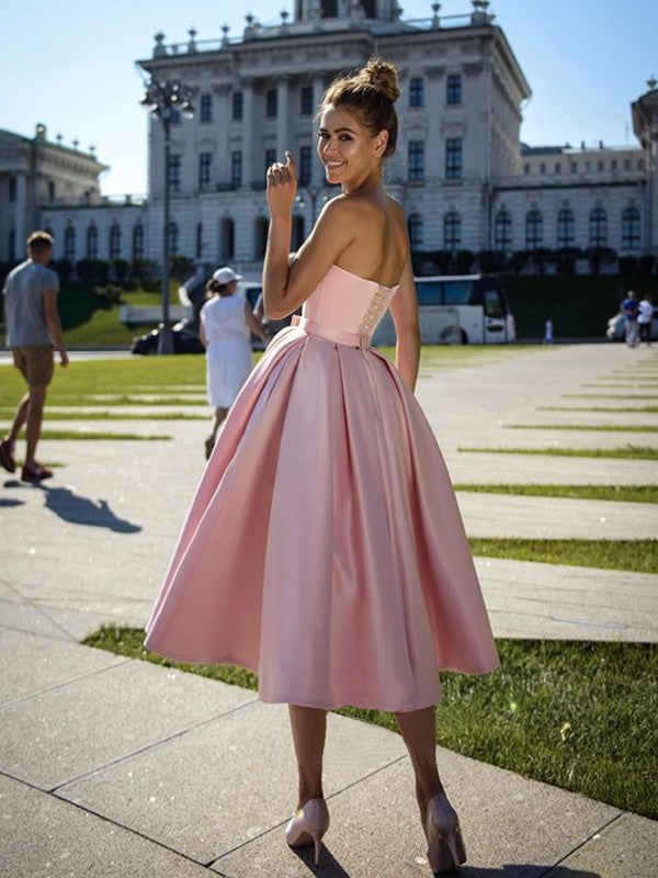 Back view of the A-Line sweetheart satin tea-length dress, showing the bowknot.