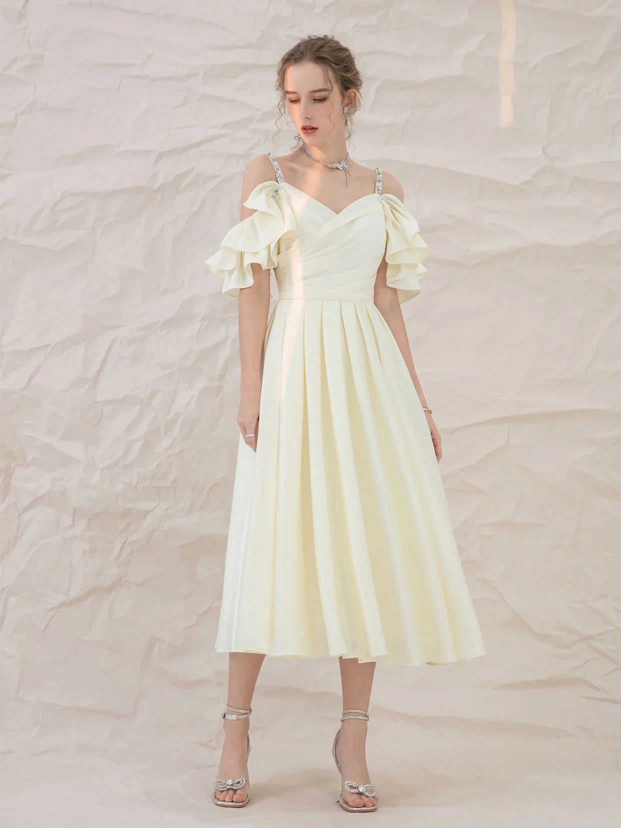 Back view of the light yellow A-line short formal dress.