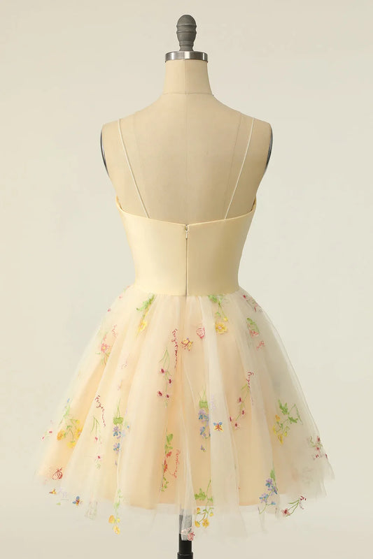 Back view of the champagne embroidered tulle homecoming dress, showcasing the A-line skirt.
