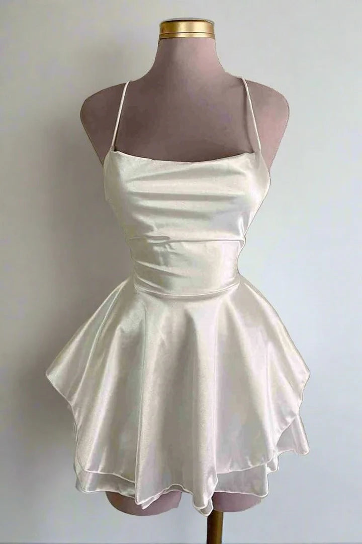 Spaghetti strap satin empire-waist short homecoming dress.