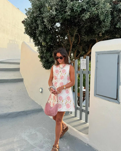 Model wearing a floral print linen blend A-line mini dress.