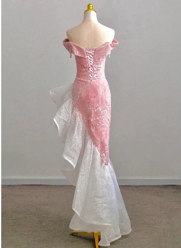 Model wearing a Koutun pink off-shoulder homecoming dress.