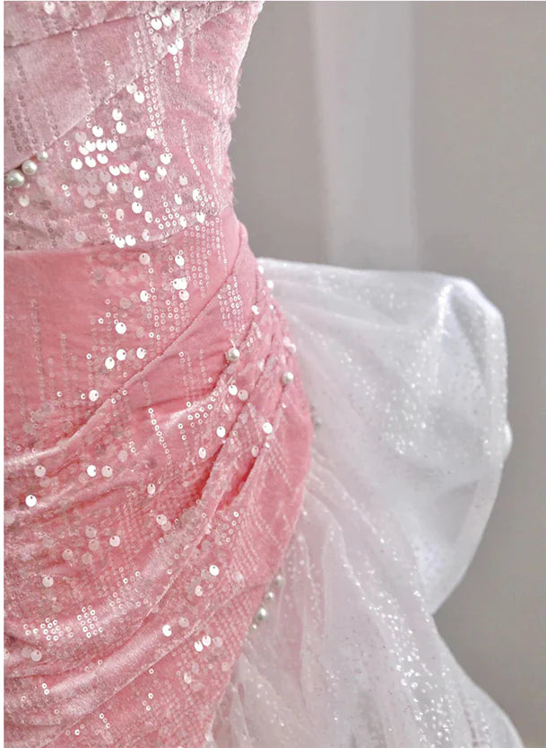 Back view of the elegant pink high-low mermaid dress.