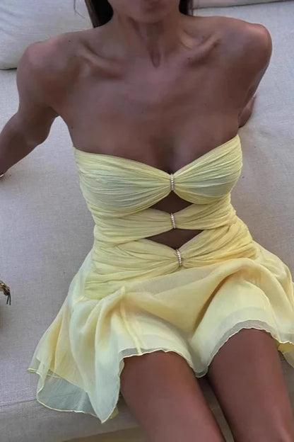 Back view of a pleated strapless mini dress, ideal for parties.