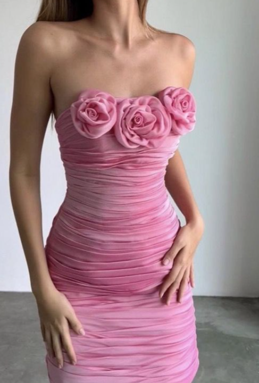 Light pink ruched tube top short homecoming dress with floral appliques.