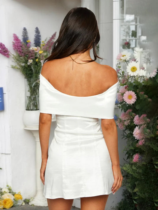 Back view of the off-shoulder mini dress, showcasing its sheath silhouette.