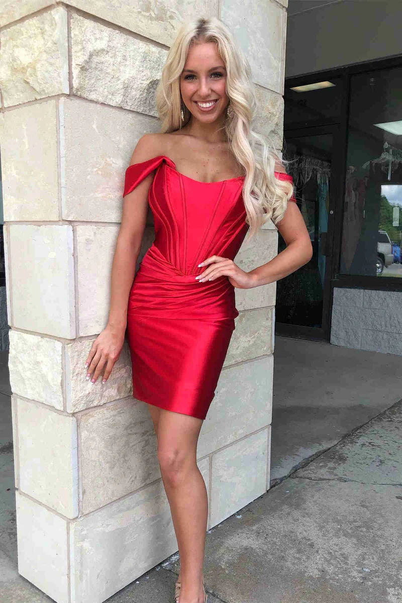 Model wearing fuchsia sheath off-shoulder satin dress, side view.