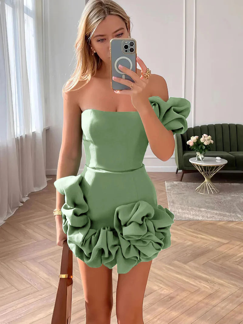 Woman wearing a strapless bodycon mini homecoming dress with ruffles.