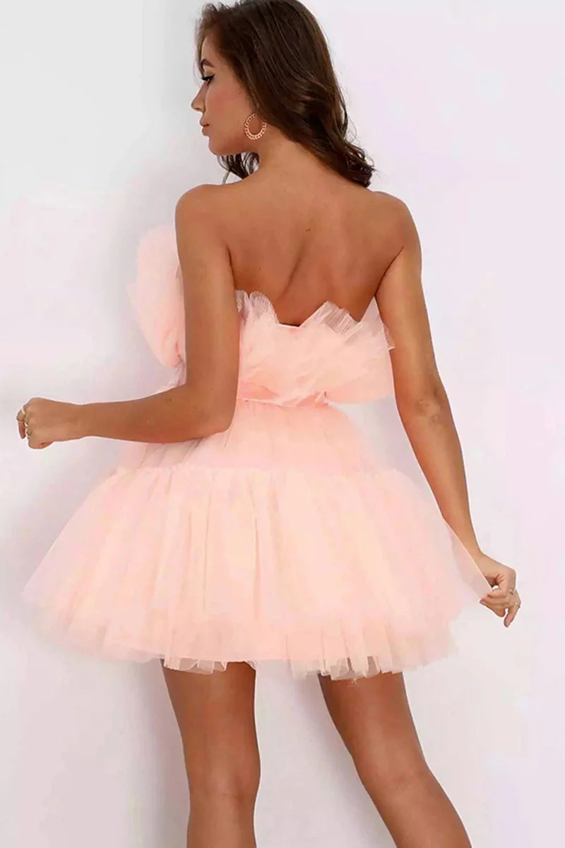 Model posing in a Koutun black strapless A-Line formal dress.
