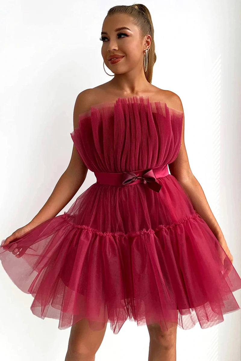 Back view of the knee-length A-Line strapless black dress.