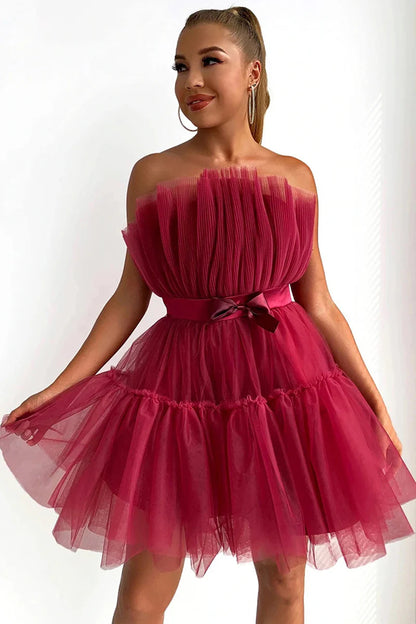 Back view of the knee-length A-Line strapless black dress.