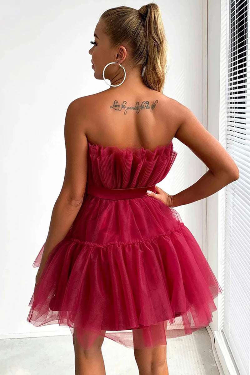 Close-up of the fabric detail on the black strapless dress.
