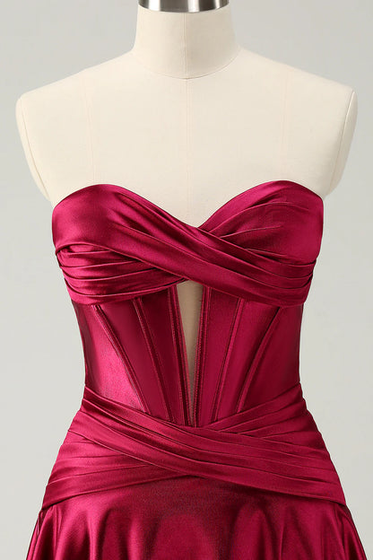 Close-up of burgundy satin fabric and sweetheart neckline.