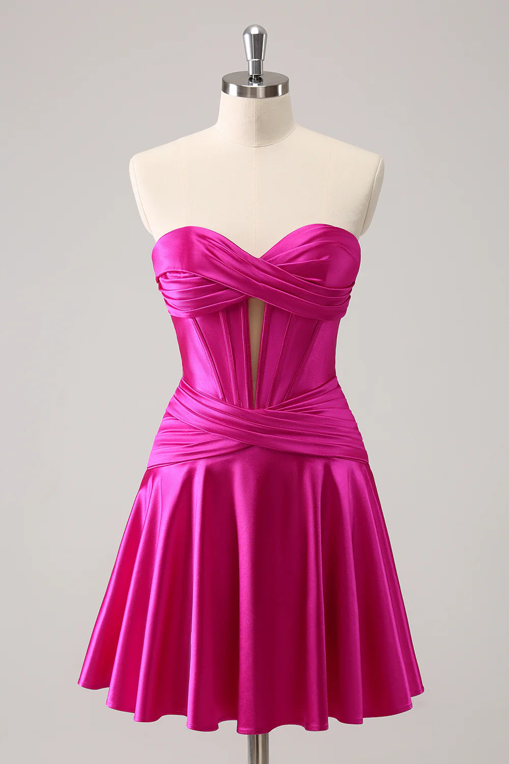 Fuchsia A-line satin homecoming dress with sweetheart strapless neckline.