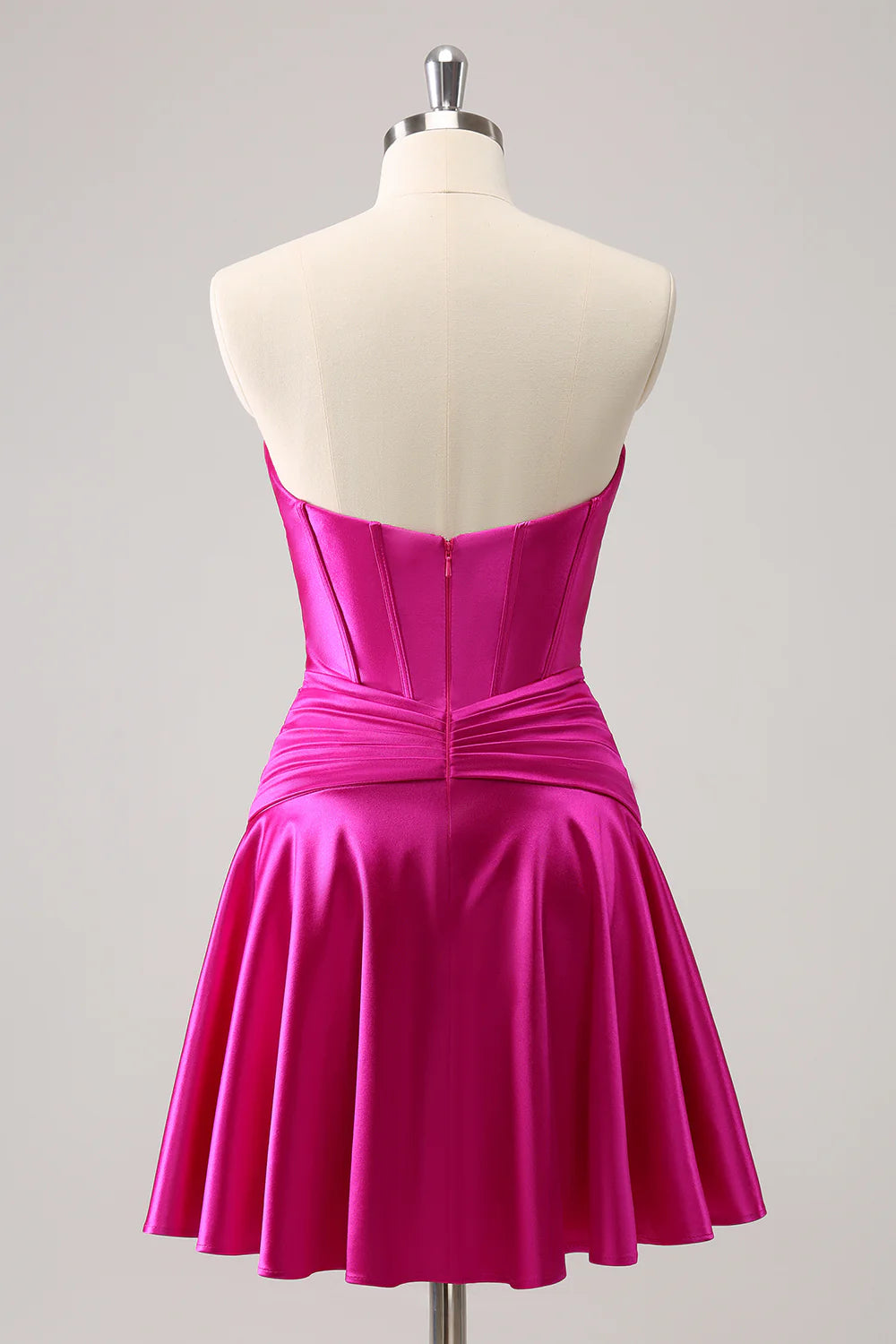 Back view of fuchsia A-line satin dress with keyhole detail.