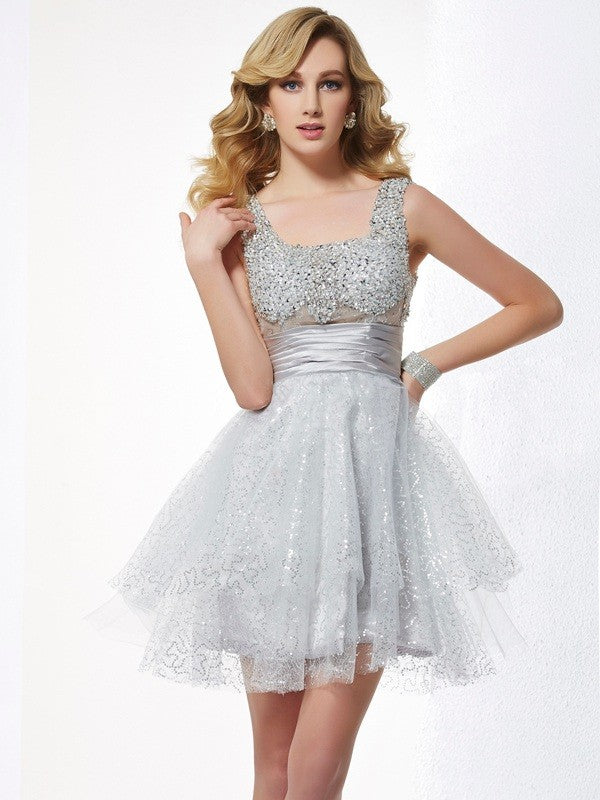 Dazzling A-Line Princess short homecoming dress with beading and straps.