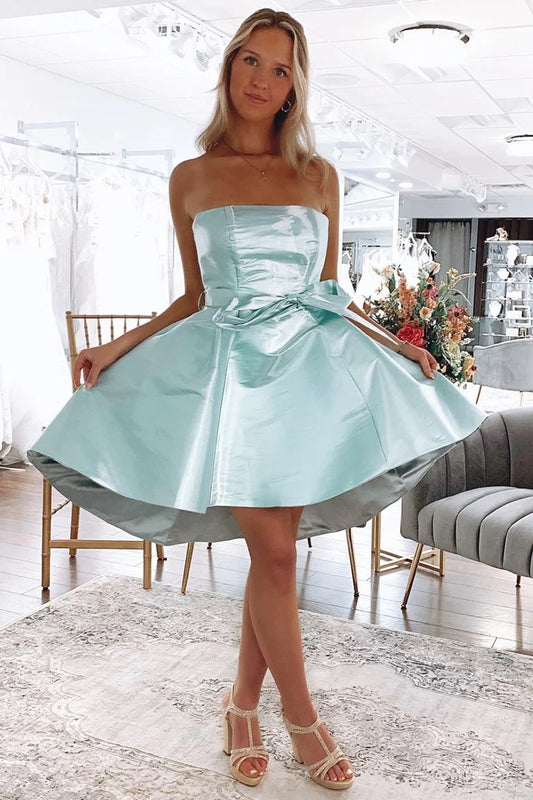 Front view of a mint A-line strapless high-low homecoming dress with a bow-knot detail.