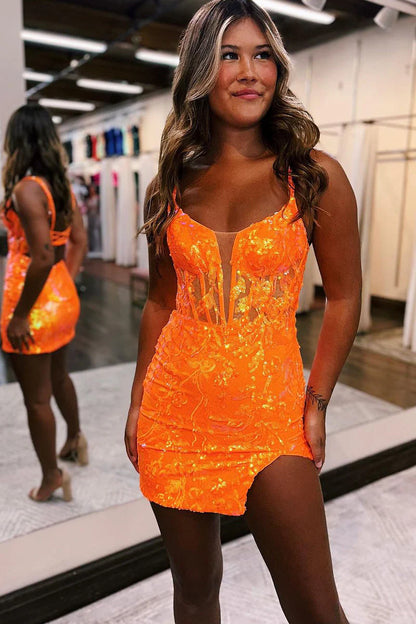 Woman wearing a dazzling V-neck sequin short homecoming dress, posing elegantly.