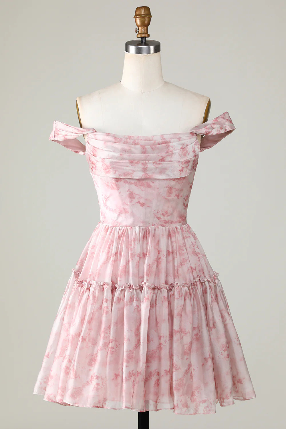 Elegant blush A-line homecoming dress with floral print and ruffles.