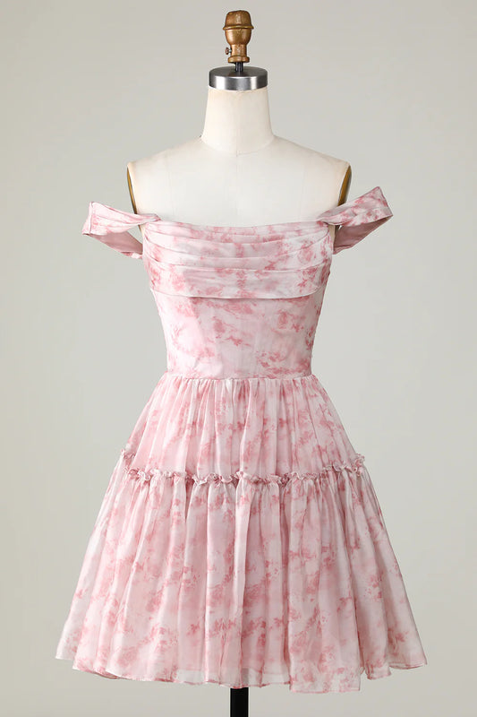 Elegant blush A-line homecoming dress with floral print and ruffles.