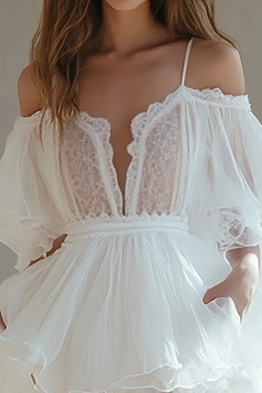 Short A-line dress with cold shoulder and ruffle details.