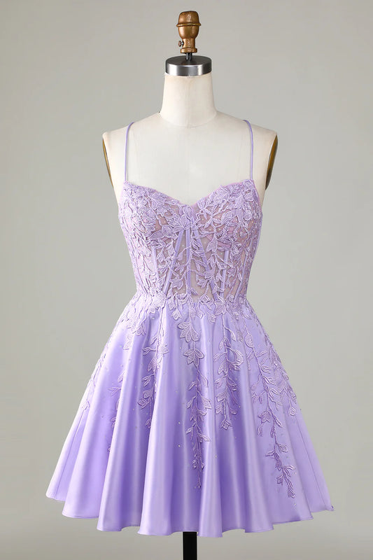 Model wearing a purple A-line satin homecoming dress with corset and lace details.