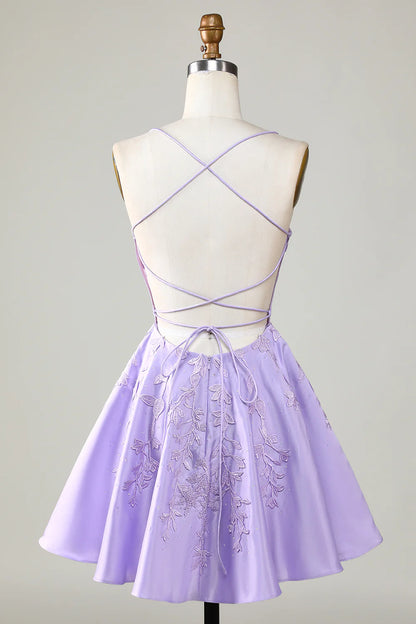 Back view of a model in a purple A-line satin homecoming dress.