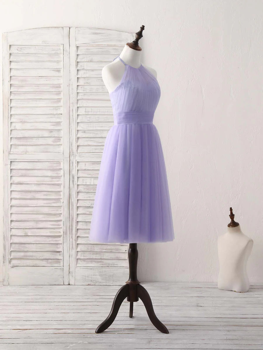 Close-up of the halterneck and bodice details of the purple tulle dress.