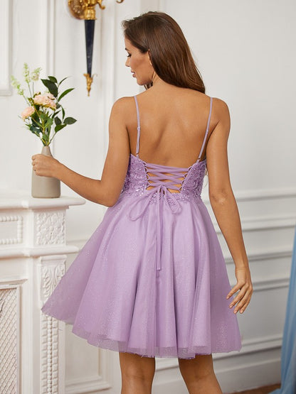 Side view of a Koutun sleeveless lace mini dress.