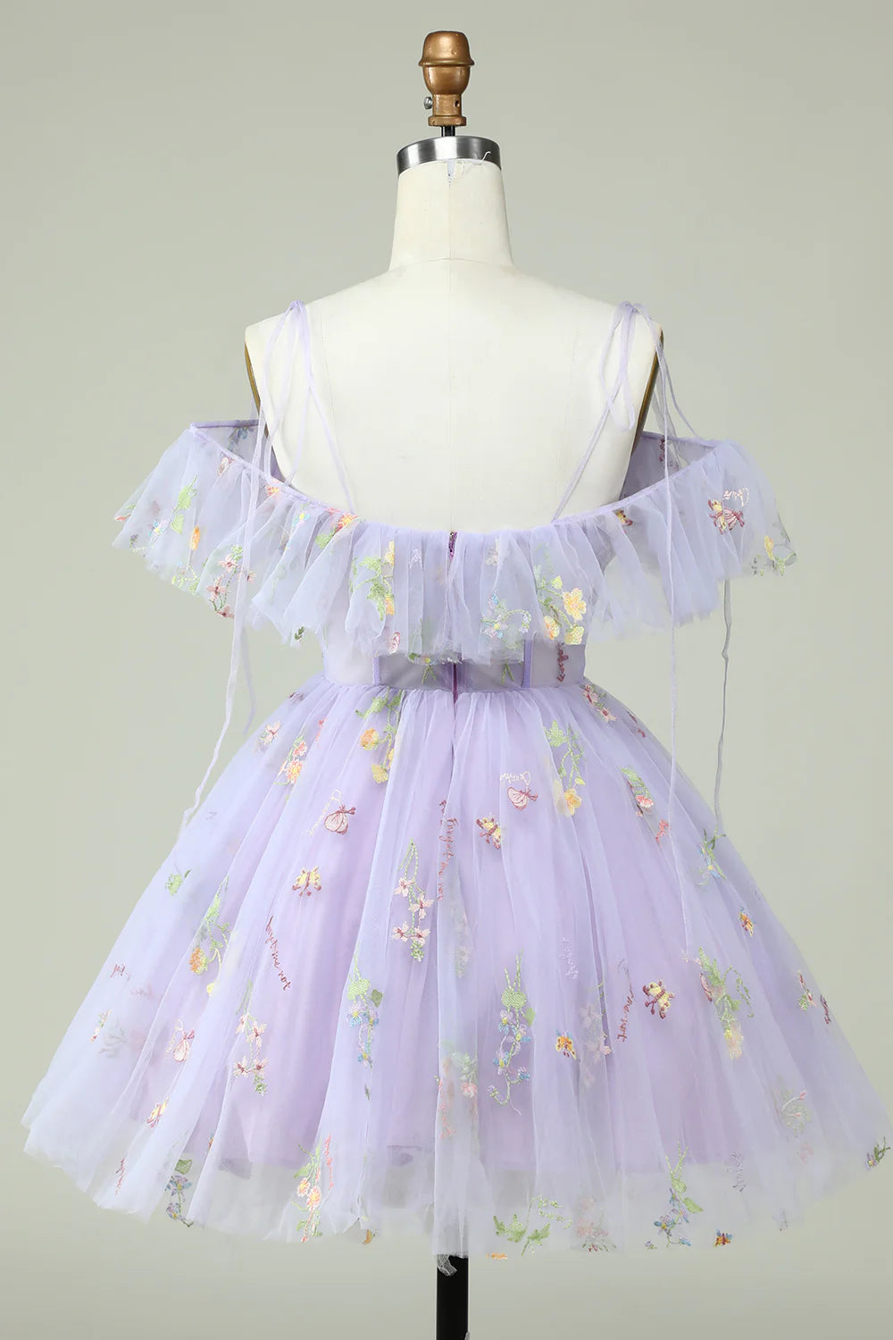 Side view of lavender off-shoulder A-Line dress with ruffled details.