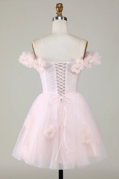 Side view of the pink A-line off-shoulder dress, showcasing floral embellishments.