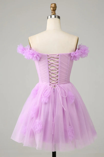 Model wearing the pink A-line off-shoulder dress, highlighting its knee-length.