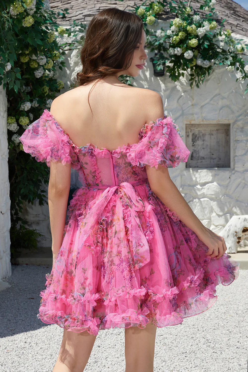 Side view of the fuchsia A-line off-shoulder tulle dress, highlighting the short sleeves.