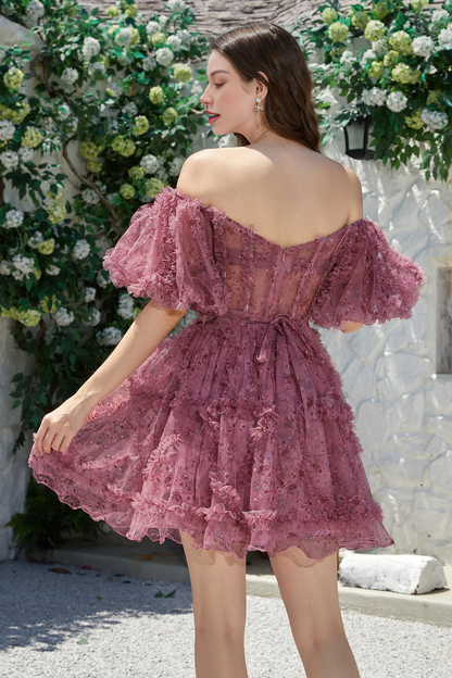 Model posing in the fuchsia off-shoulder homecoming dress, showcasing its movement.