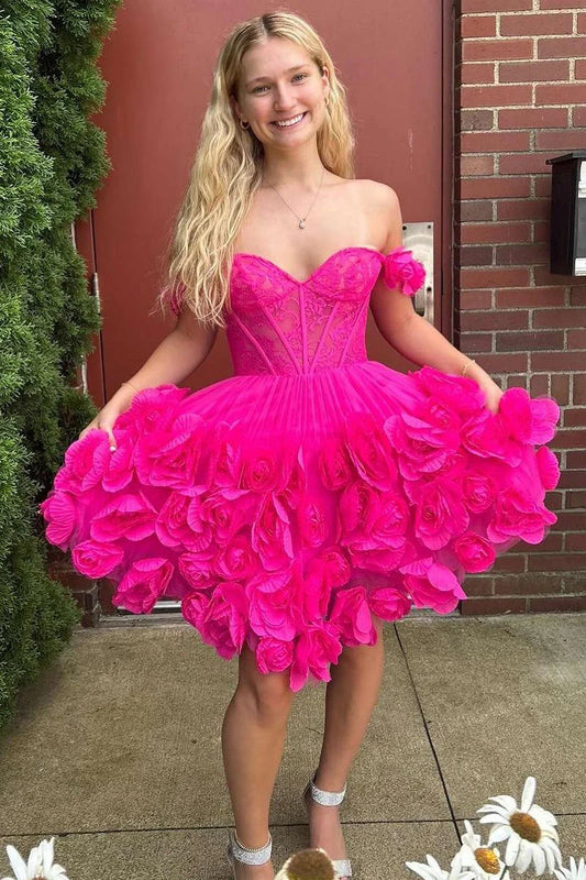 Model wearing a pink A-line off-shoulder satin homecoming dress with floral details.