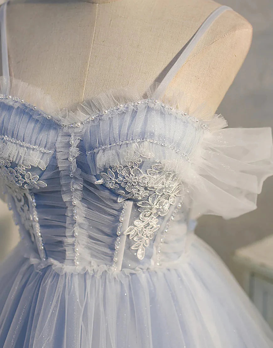 Close-up of the pleated details on the blue tulle homecoming dress.