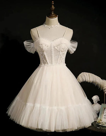 Side view of the model in the blue off-shoulder tulle dress.