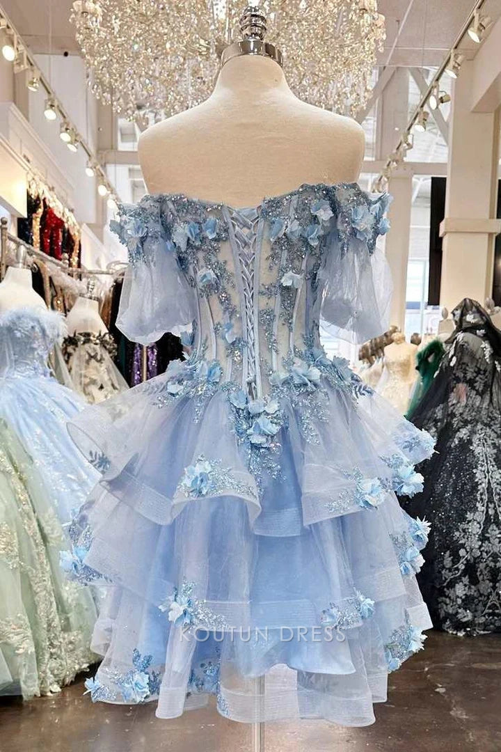 Back view of the sky blue A-line off-shoulder puffy sleeve floral ruffled short homecoming dress, showing lace-up detail.