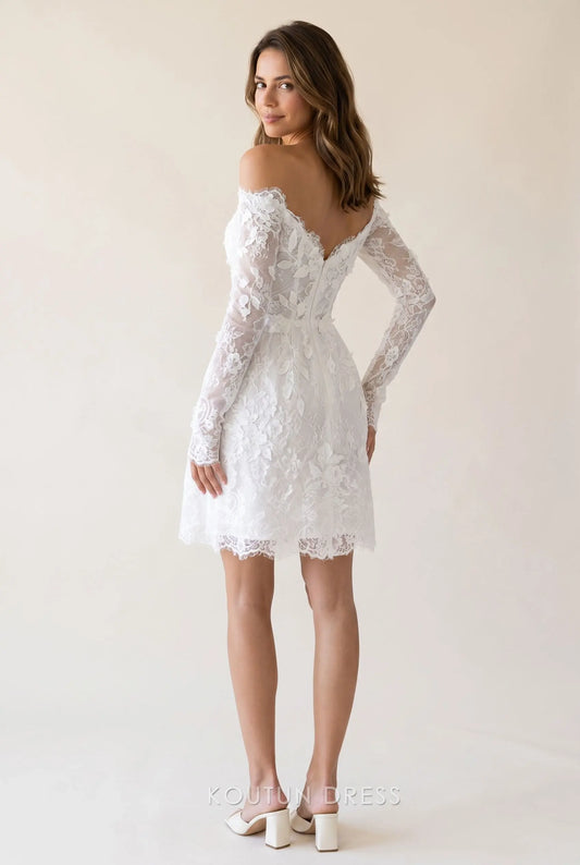 Back view of the white lace off-shoulder mini homecoming dress, showing the corset bodice and A-line skirt.