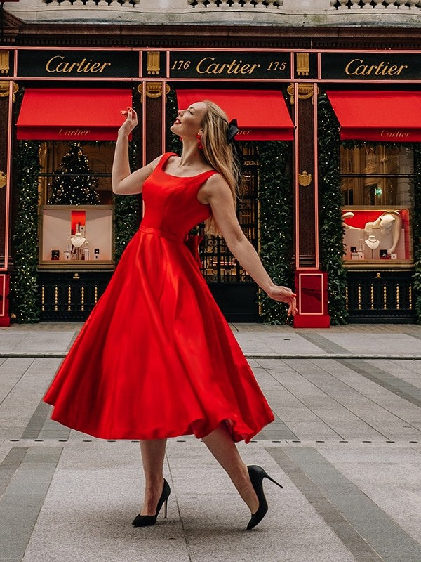 Side profile of a sleeveless A-Line satin dress, perfect for homecoming.
