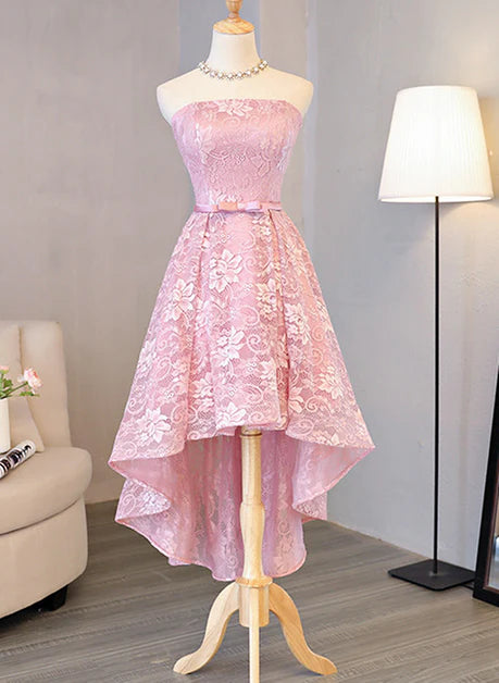 Model wearing a pink A-line high-low lace homecoming dress.